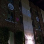 The Centennial logo and hashtag, as well as butterflies and birds, were projected onto the Atrium's brick wall.